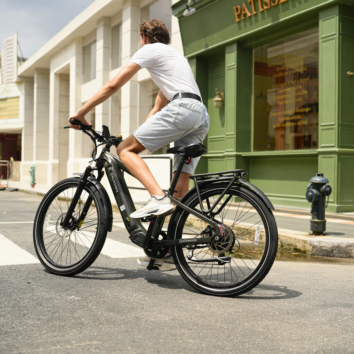 Rider commuting on a Cycrown DREMAX high-step electric bike